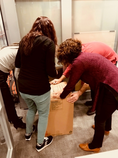Photo: Final station: Packing the backpacks into boxes