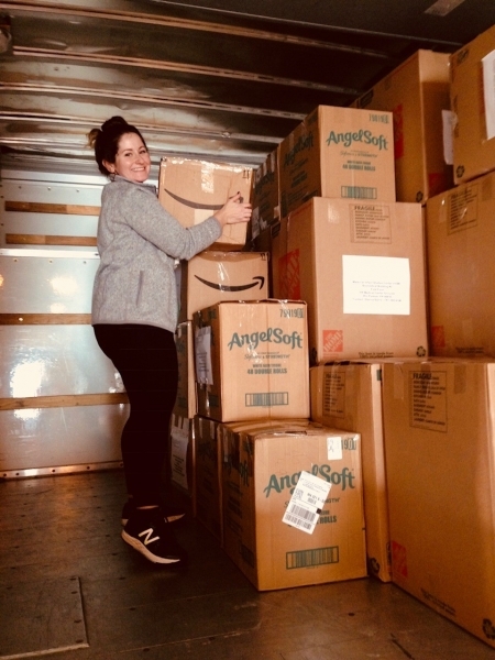 Photo: Lauren unloading the U-haul at the airport