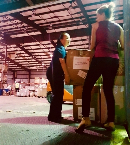Photo: San Juan City Hospital staff loading boxes