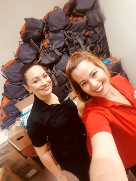 Photo: University of Puerto Rico staff with backpacks stacked at clinic